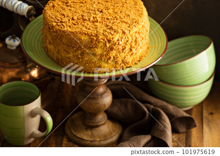 Caramel cake with honey and cream frosting Caramel cake with honey and cream frosting 101975619