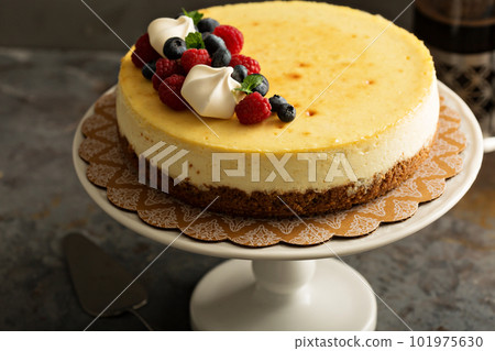 New York cheesecake on a cake stand New York cheesecake on a cake stand 101975630