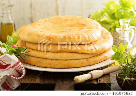 Flatbreads with cheese filling 101975685