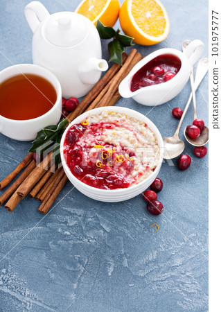 Fall breakfast with oatmeal and cranberry sauce 101975777