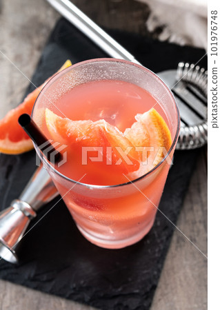 Sea breeze cocktail in glass on wooden table 101976748
