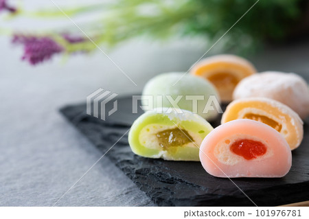 Japanese colorful mochi on gray stone surface Japanese colorful mochi on gray stone surface 101976781