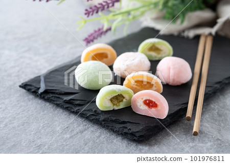 Japanese colorful mochi on gray stone surface Japanese colorful mochi on gray stone surface 101976811