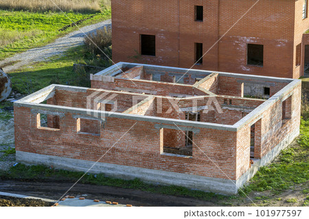 Construction of a new house. Brick walls. 101977597