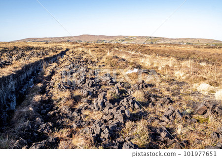 Peat Turf cutting in County Donegal - Ireland Peat Turf cutting in County Donegal - Ireland 101977651