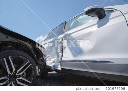 Cars crashed heavily in road accident after collision on city street. Road safety and insurance concept Cars crashed heavily in road accident after collision on city street. Road safety and insurance concept 101978206