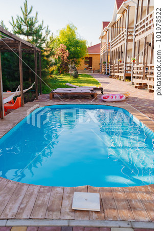 A small outdoor pool in hotel with limited space.  101978522