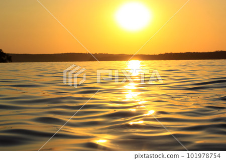 Sunset, sea waves close up, low-angle of view. Water surface. River, lake, pond. Sunset, sea waves close up, low-angle of view. Water surface. River, lake, pond. 101978754