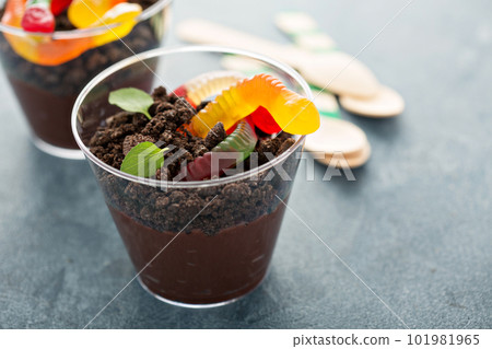 Children chocolate dessert in a cup dirt and worms Children chocolate dessert in a cup dirt and worms 101981965