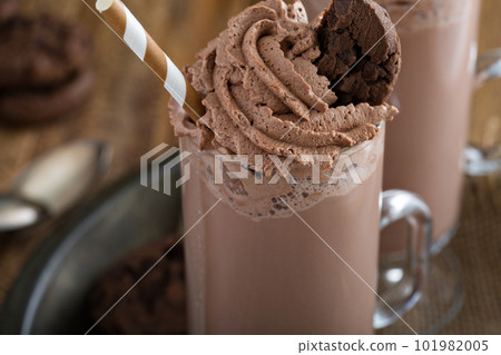Chocolate cookie milkshake in tall mugs 101982005