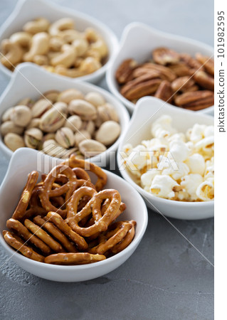 Variety of healthy snacks in white bowls Variety of healthy snacks in white bowls 101982595