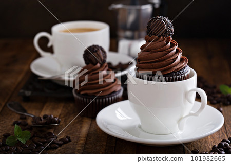 Gourmet chocolate cupcakes with a candy on top 101982665