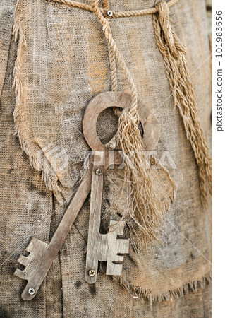A bunch of old wooden keys hanging on a rope, close-up 101983656