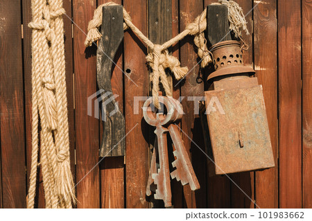 A bunch of old wooden keys hanging on a rope, close-up A bunch of old wooden keys hanging on a rope, close-up 101983662