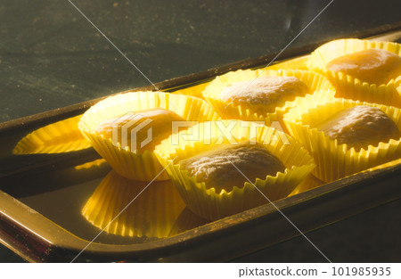 Yellow mango and lemon mochi mochies, wooden chopsticks on a golden tray top view. Asian food, sweets and delicacies. Japanese traditional confectionary ice cream made of rice flour dough. Soft focus. Yellow mango and lemon mochi mochies, wooden chopsticks on a golden tray top view. Asian food, sweets and delicacies. Japanese traditional confectionary ice cream made of rice flour dough. Soft focus. 101985935