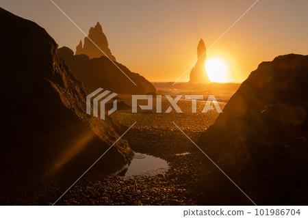 Scenic Black Sand Beach In Iceland. Sunset over Volcanic Cliffside. Stunning Ocean Coast. Unusual Pure Nature. Famous Tourist Location near Vik. Traveling in Iceland. 101986704