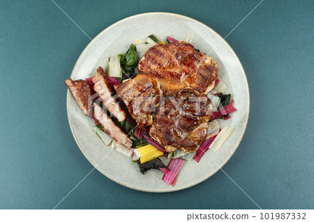 Tasty meat steak with green salad. Tasty meat steak with green salad. 101987332