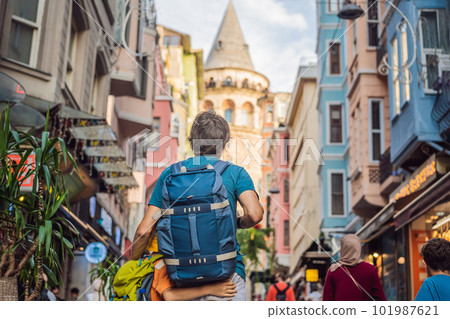 Portrait of father and son tourists with view of Galata tower in Beyoglu, Istanbul, Turkey. Turkiye. Traveling with kids concept 101987621