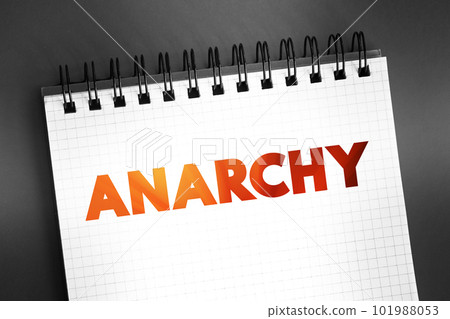 Anarchy - society being freely constituted without authorities or a governing body, text on notepad, concept background 101988053