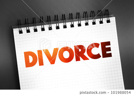 Divorce - canceling or reorganizing of the legal duties and responsibilities of marriage, text on notepad, concept background 101988054
