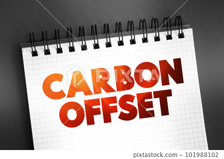 Carbon offset - reduction of emissions of carbon dioxide made in order to compensate for emissions made elsewhere, text concept on notepad 101988102