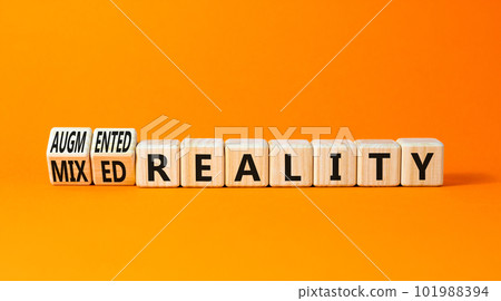 Augmented or mixed reality symbol. Concept words Augmented reality Mixed reality on wooden cubes. Beautiful orange table orange background. Business augmented or mixed reality concept. Copy space. 101988394