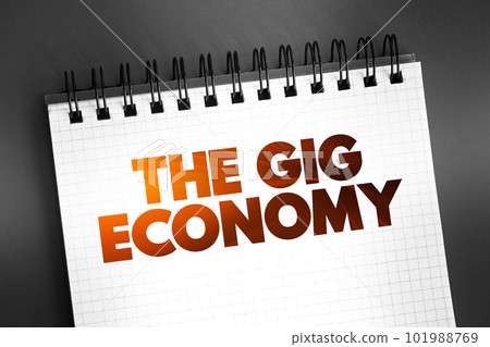 The Gig Economy text on notepad, concept background 101988769