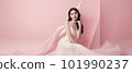 Asian woman with a beautiful face against light pink background - full body studio shot - made with 101990237