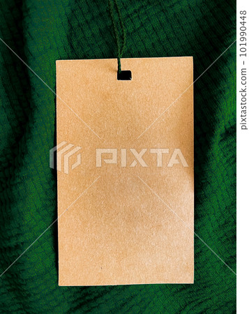 Blank fashion label tag, sale price card on luxury fabric background, shopping and retail Blank fashion label tag, sale price card on luxury fabric background, shopping and retail 101990448