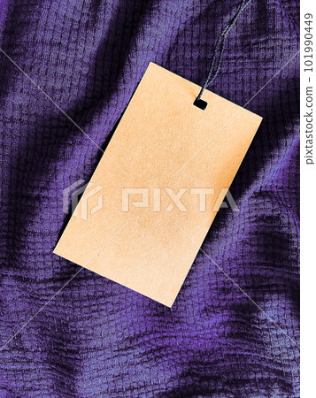 Blank fashion label tag, sale price card on luxury fabric background, shopping and retail Blank fashion label tag, sale price card on luxury fabric background, shopping and retail 101990449