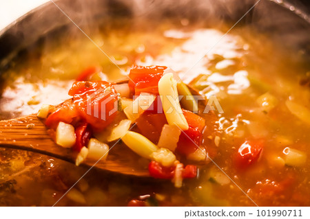 Cooking vegetable soup in saucepan, comfort food and homemade meal 101990711