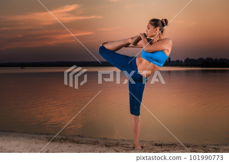 yoga at sunset on the beach. yoga at sunset on the beach. 101990773