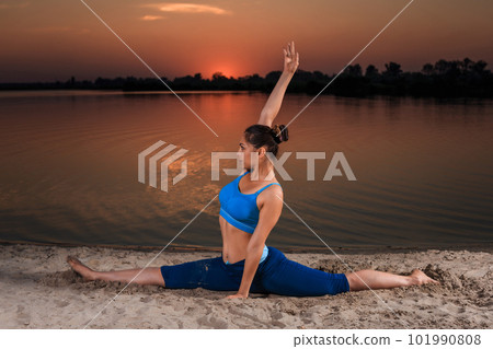 yoga at sunset on the beach. yoga at sunset on the beach. 101990808