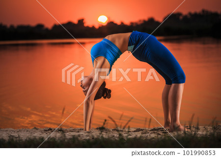 yoga at sunset on the beach. yoga at sunset on the beach. 101990853