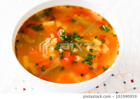 Hot vegetable soup in bowl, comfort food and homemade meal Hot vegetable soup in bowl, comfort food and homemade meal 101990959