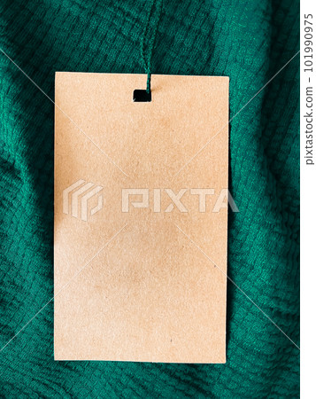 Blank fashion label tag, sale price card on luxury fabric background, shopping and retail 101990975