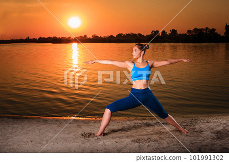 yoga at sunset on the beach. yoga at sunset on the beach. 101991302
