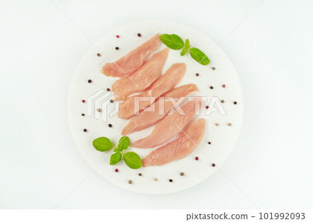 Raw fresh chicken fillet on a white plate with fresh herbs.Food concept.Top view.Chicken breast Fillets.Close up.Raw chicken meat.Copy space.Food for retail.Ogranic food,healthy eating. 101992093