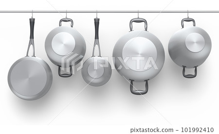 Set of stewpot, frying pan and chrome plated cookware hanging on shelf on white 101992410
