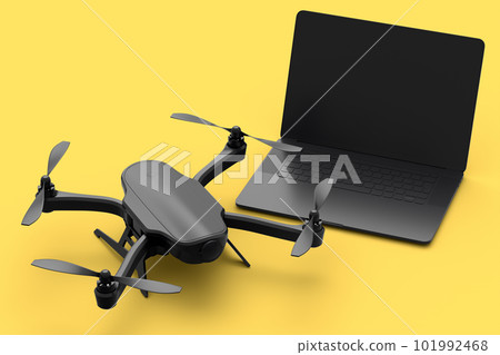 Top view of workspace and photography gear like laptop and drone on yellow 101992468