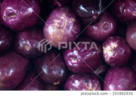 Stack of eggplants on a market stall Stack of eggplants on a market stall 101992938