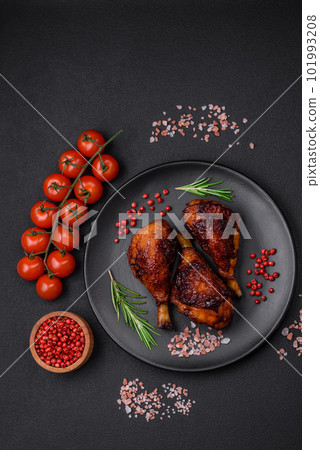 Delicious grilled chicken legs with spices and herbs in teriyaki sauce Delicious grilled chicken legs with spices and herbs in teriyaki sauce 101993208