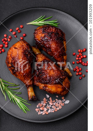 Delicious grilled chicken legs with spices and herbs in teriyaki sauce Delicious grilled chicken legs with spices and herbs in teriyaki sauce 101993209