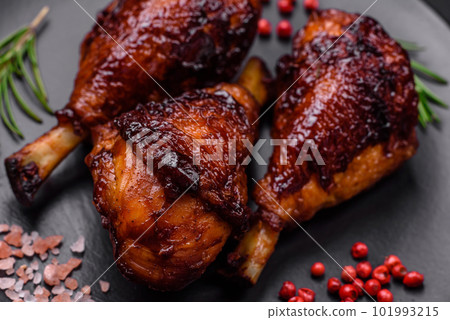 Delicious grilled chicken legs with spices and herbs in teriyaki sauce 101993215