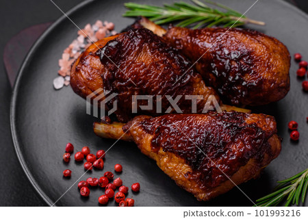 Delicious grilled chicken legs with spices and herbs in teriyaki sauce 101993216