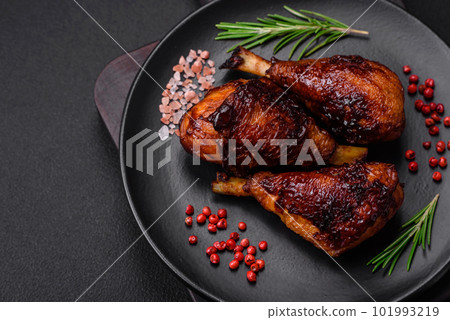 Delicious grilled chicken legs with spices and herbs in teriyaki sauce 101993219