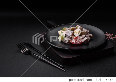 Delicious salad with boiled beef tongue, quail eggs, tomatoes and cucumber 101993238