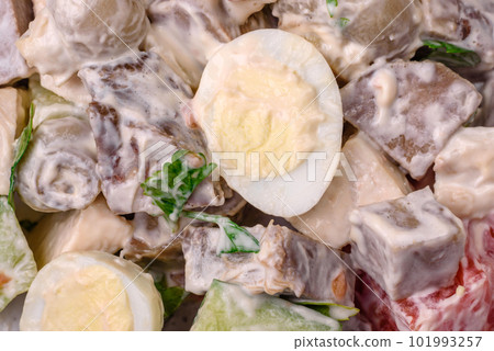 Delicious salad with boiled beef tongue, quail eggs, tomatoes and cucumber 101993257