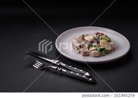 Delicious salad with boiled beef tongue, quail eggs, tomatoes and cucumber 101993259