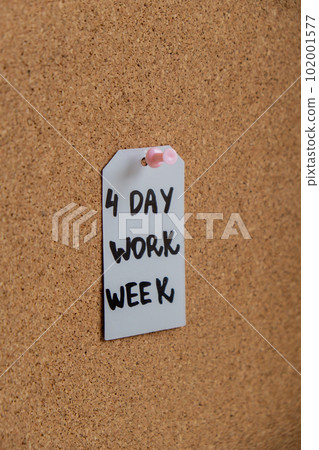 4 day work week text on paper note pinned to desk four day working week concept. Modern approach doing business short workweek. Effectiveness of employees. Productivity and efficiency 4 day work week text on paper note pinned to desk four day working week concept. Modern approach doing business short workweek. Effectiveness of employees. Productivity and efficiency 102001577
